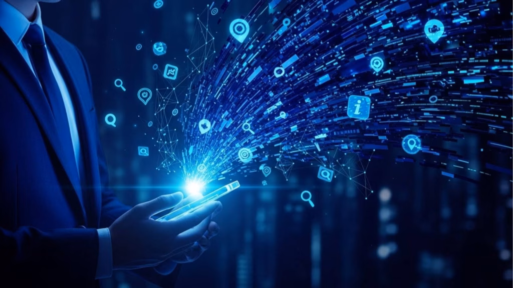 Pessoa de terno segurando um celular com fluxo de dados, ícones e elementos digitais saindo da tela em direção ao espaço, simbolizando conectividade e tecnologia da informação.